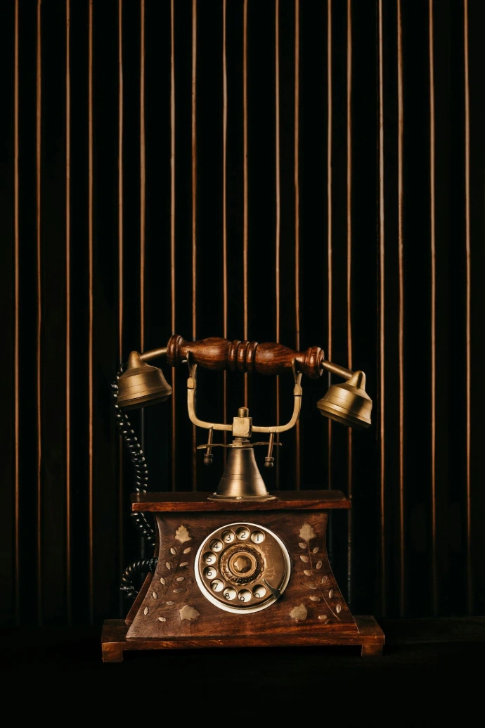 black and gold rotary phone